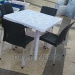 aset of atable and steel legs armless chair