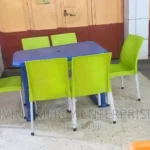 rectangular table and armless chairs