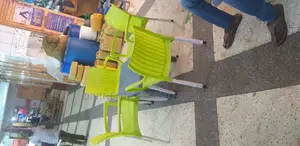 plastic armed chair and atable