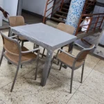 plastic armed chair with square table straight legs